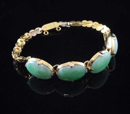 A Chinese gold and jade bracelet, approx. 6.25in.